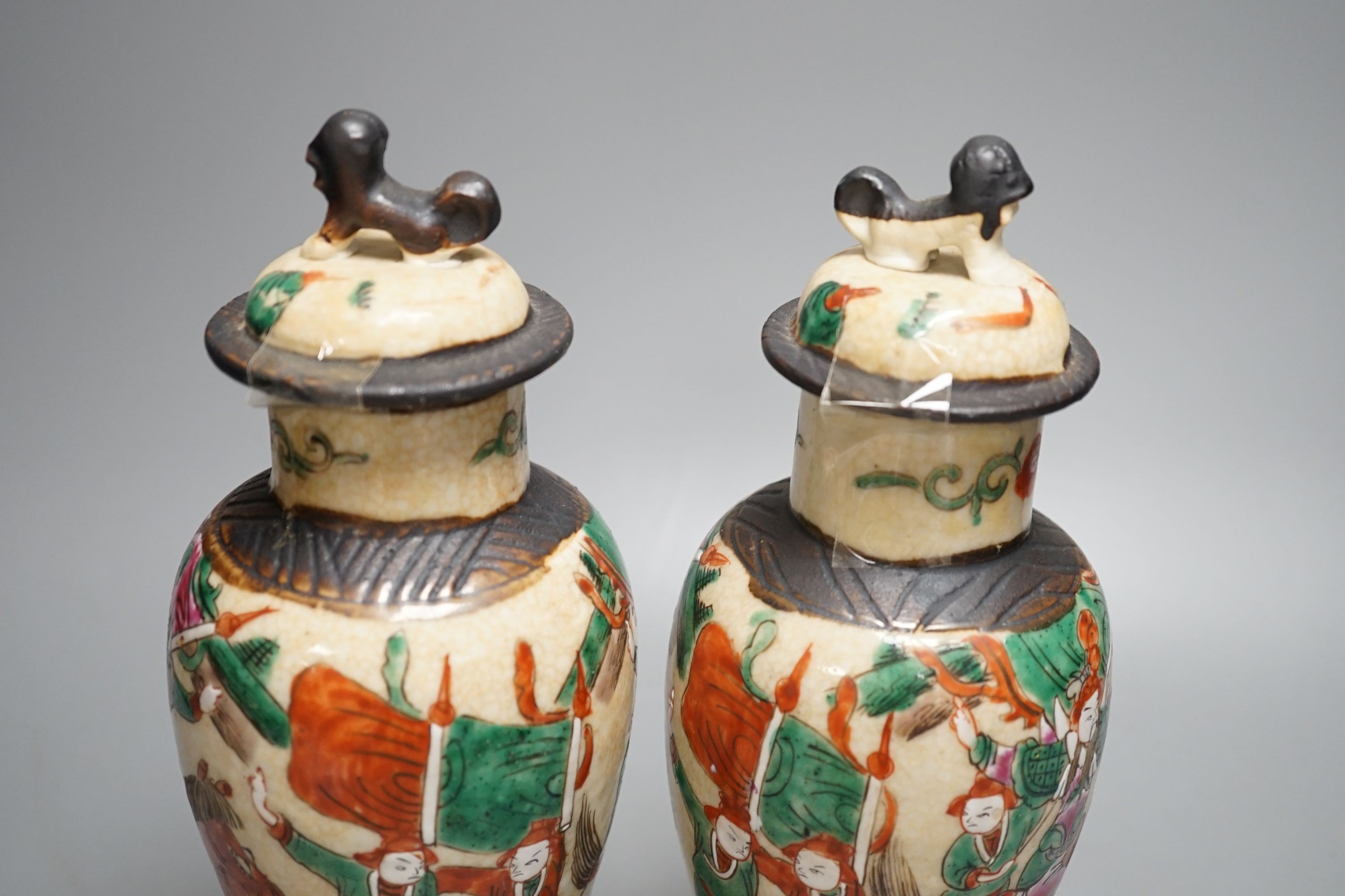 A pair of Chinese famille rose crackle glaze baluster jars and covers, 27cm.